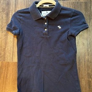 Abercrombie kids navy collared polo shirt size medium.  White moose logo.